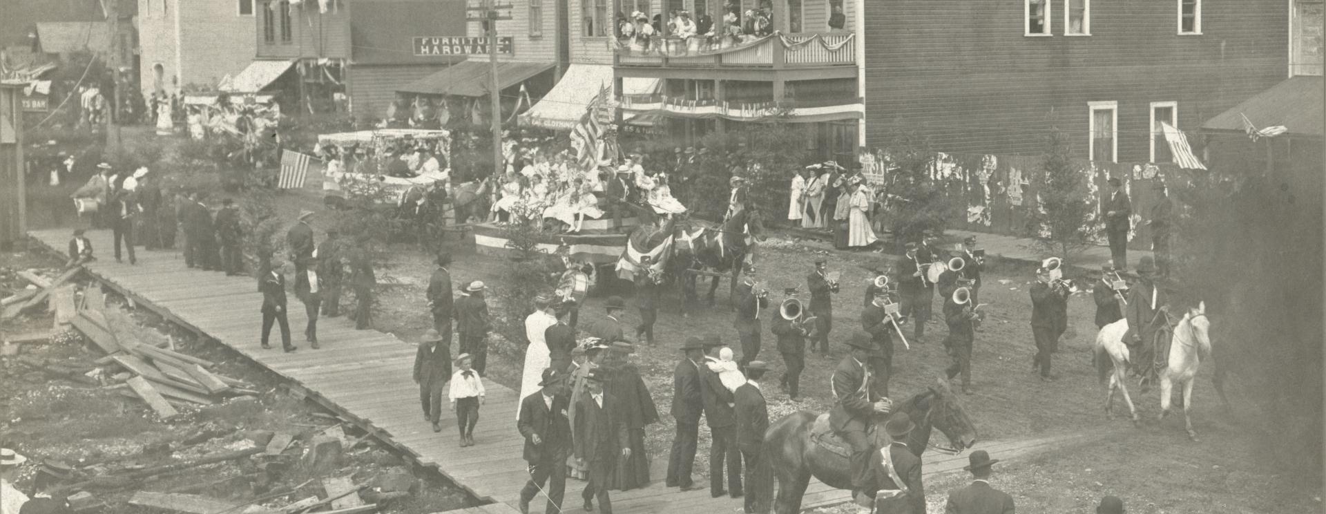Old black and white photo of a 4th of July parade in historic Tenino